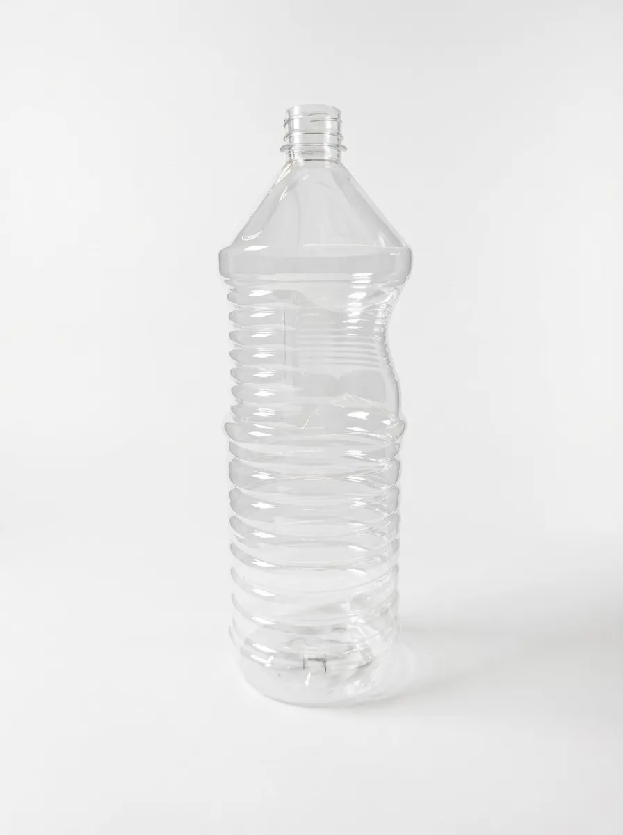 Large clear PET bottle with triangular shoulder and deep ribbing