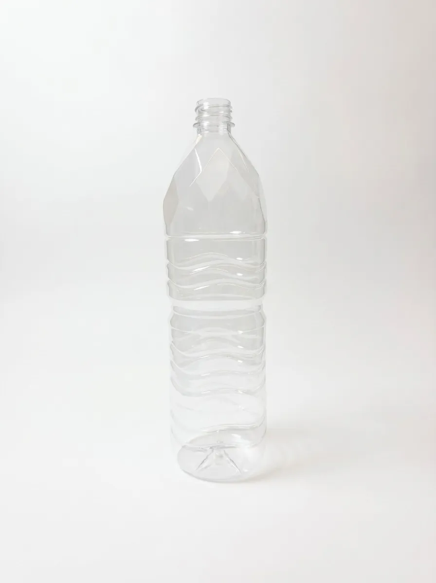 Large clear PET bottle with diamond shoulder and wave grooves