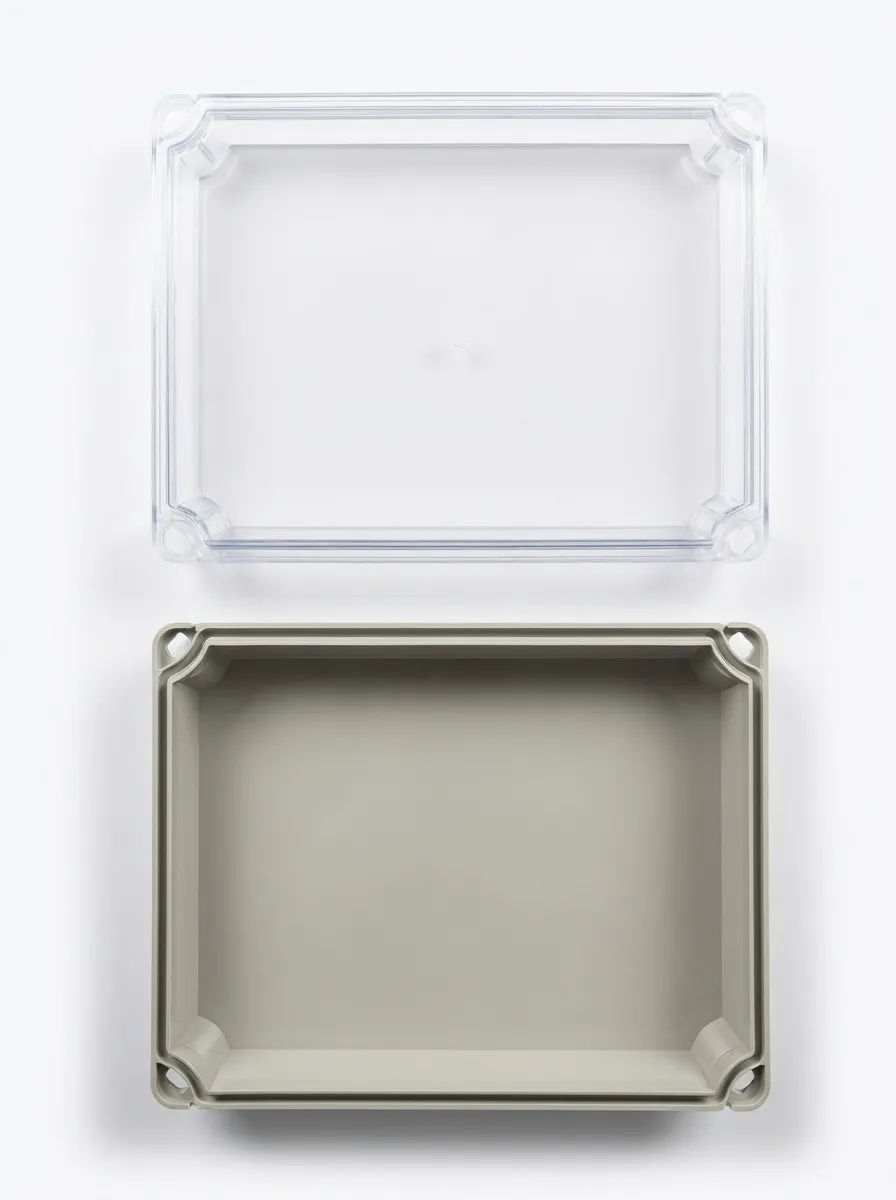 Electrical junction box with transparent cover and gray body